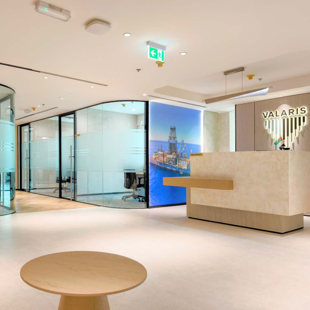 Modern corporate office interior with glass office partitions and reception area at Valaris Dubai