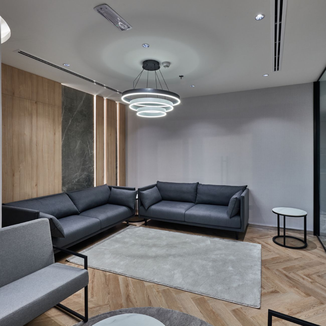 Modern office lounge with custom wood joinery and minimalist furniture by leading joinery companies in Dubai